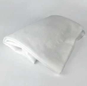 Vilka unika egenskaper gör nålad bomull oumbärlig i både industri- och hemapplikationer?